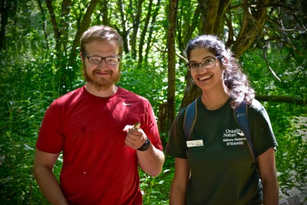 Smera Sukumar and Damien Mullin find a green frog