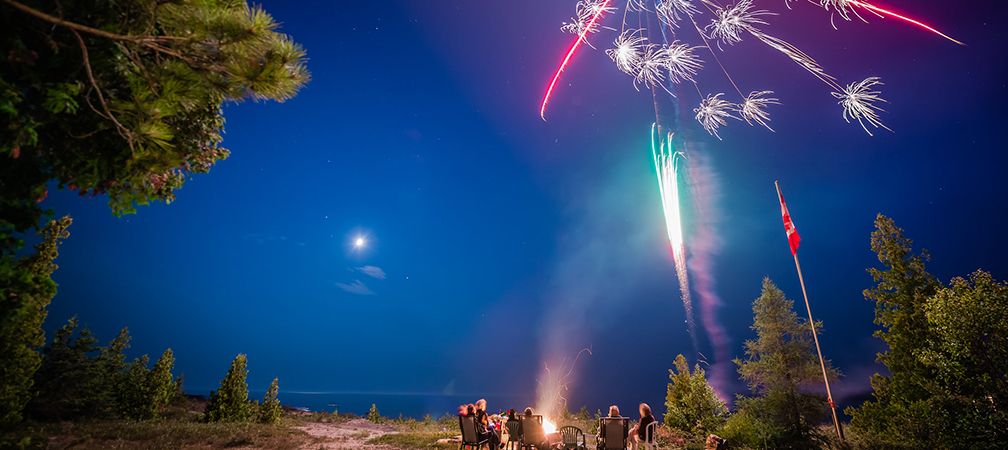 Fireworks at the beach near a cottage