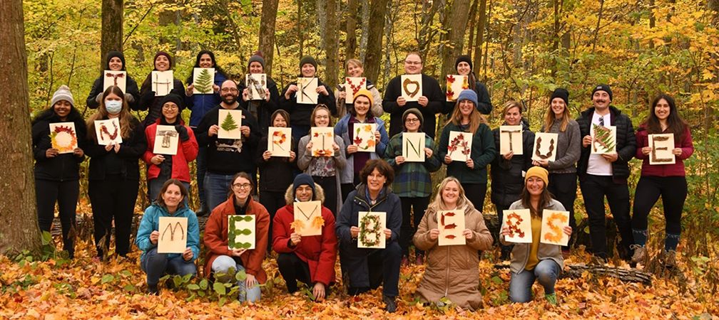 Ontario Nature staff holding signs of gratitude