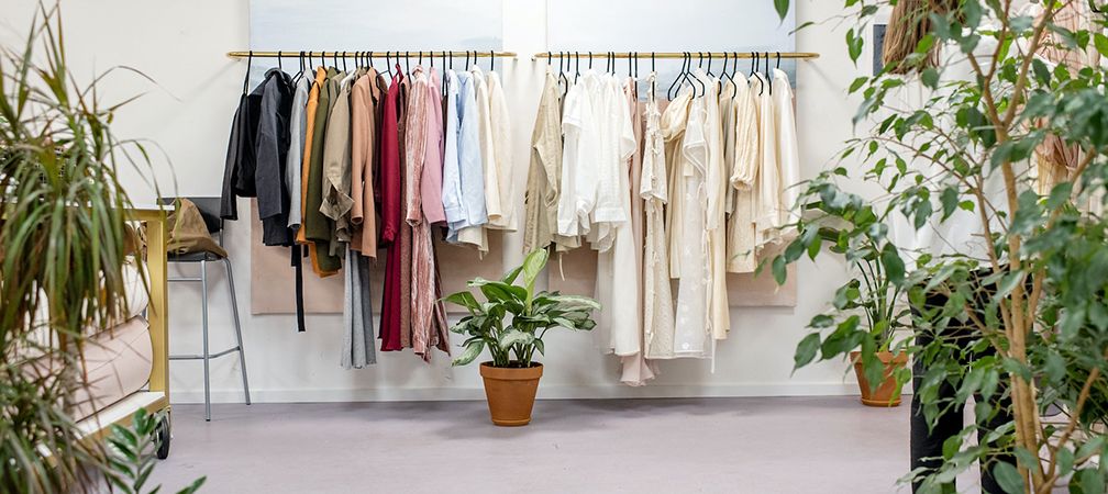clothes hanging on rack indoors