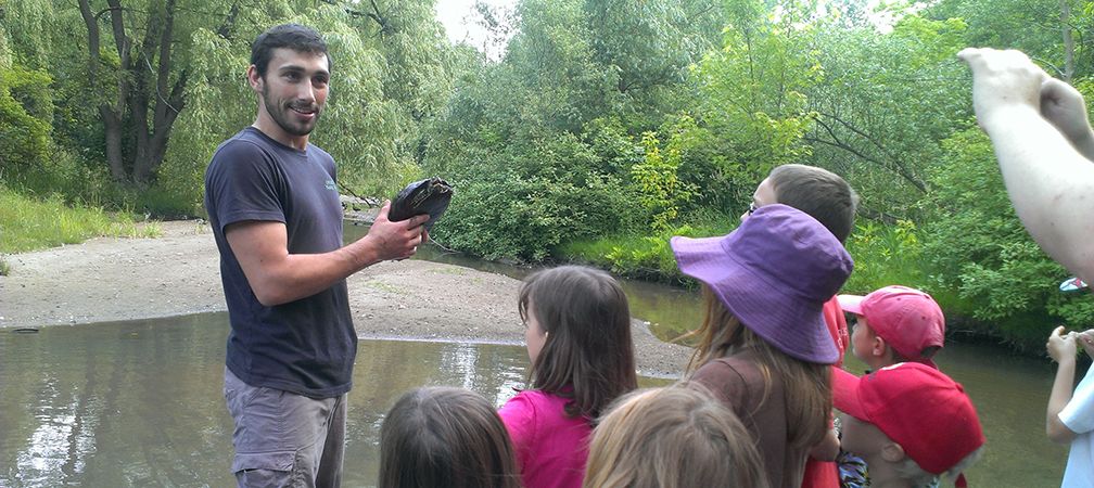 James presenting non-native red-eared slider to students, Milligan's Pond, Barrie