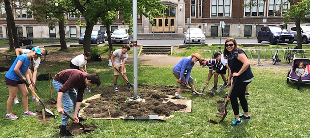 Students creating a wildflower garden, rewildling, student environmental leadership, naturalized spaces, access to nature, pollinator-friend, wildlife-friendly, urban habitat, young leaders