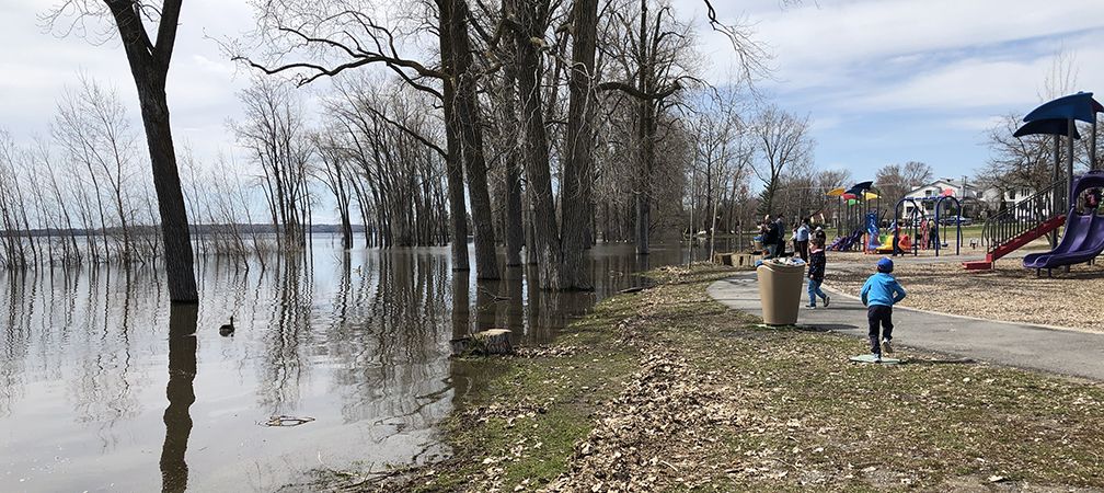 Major flooding, submerged landscape nearby playground