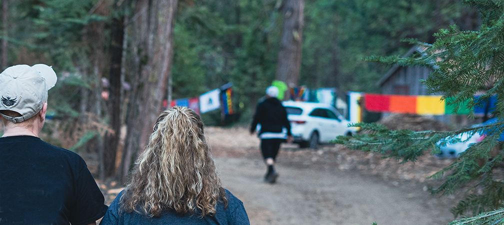 Enjoying a walk during an LGBTQ2SIA+ camping event, Pride, Lesbian Gay Bisexual Transgender Queer Two-spirited Intersex and Asexual +